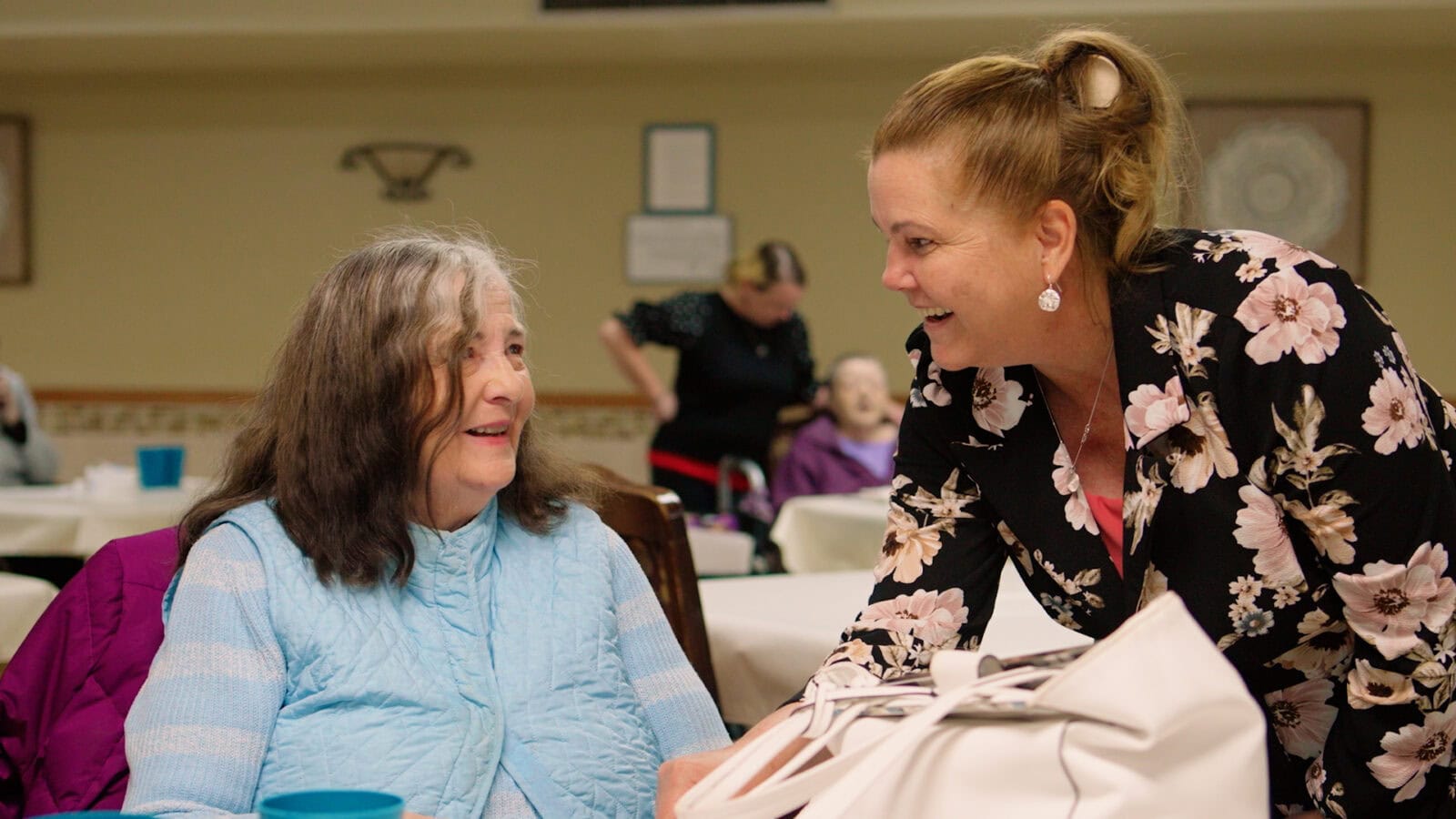 Cedar Woods assisted living resident with a care team member in Belleville, Michigan
