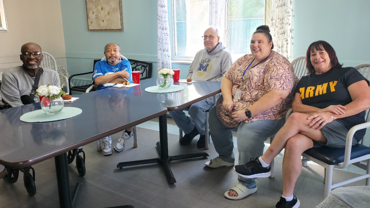 cedar woods residents at table socializing