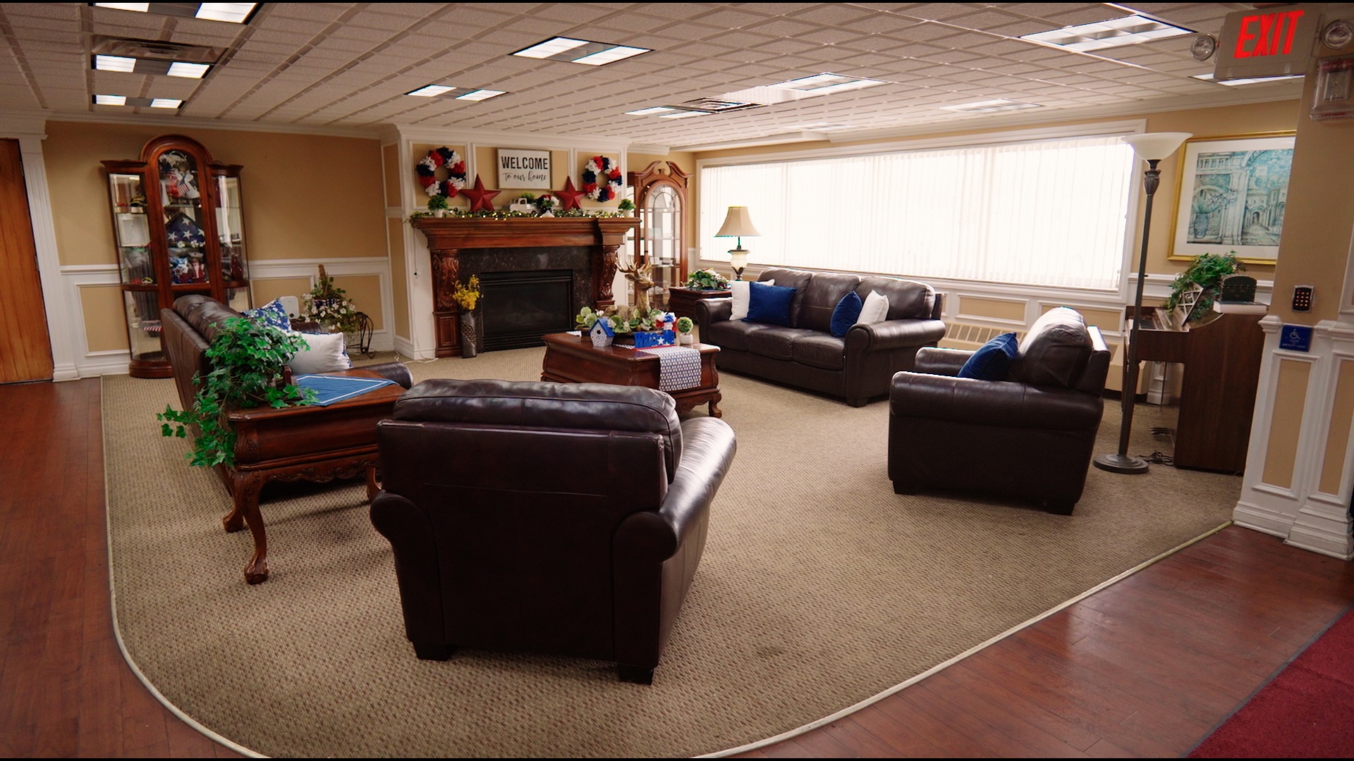 Renovated and inviting common area at Cedar Woods Assisted Living featuring comfortable seating, natural light, and home-like décor.