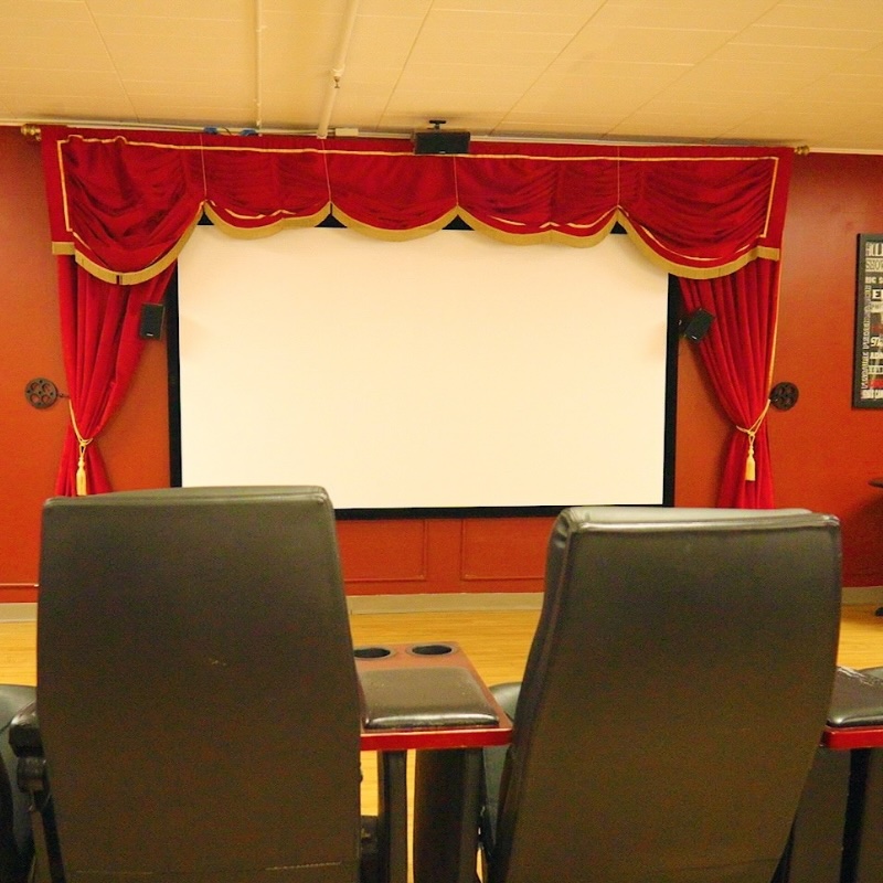 Cozy assisted living movie theater room at Cedar Woods in Belleville MI