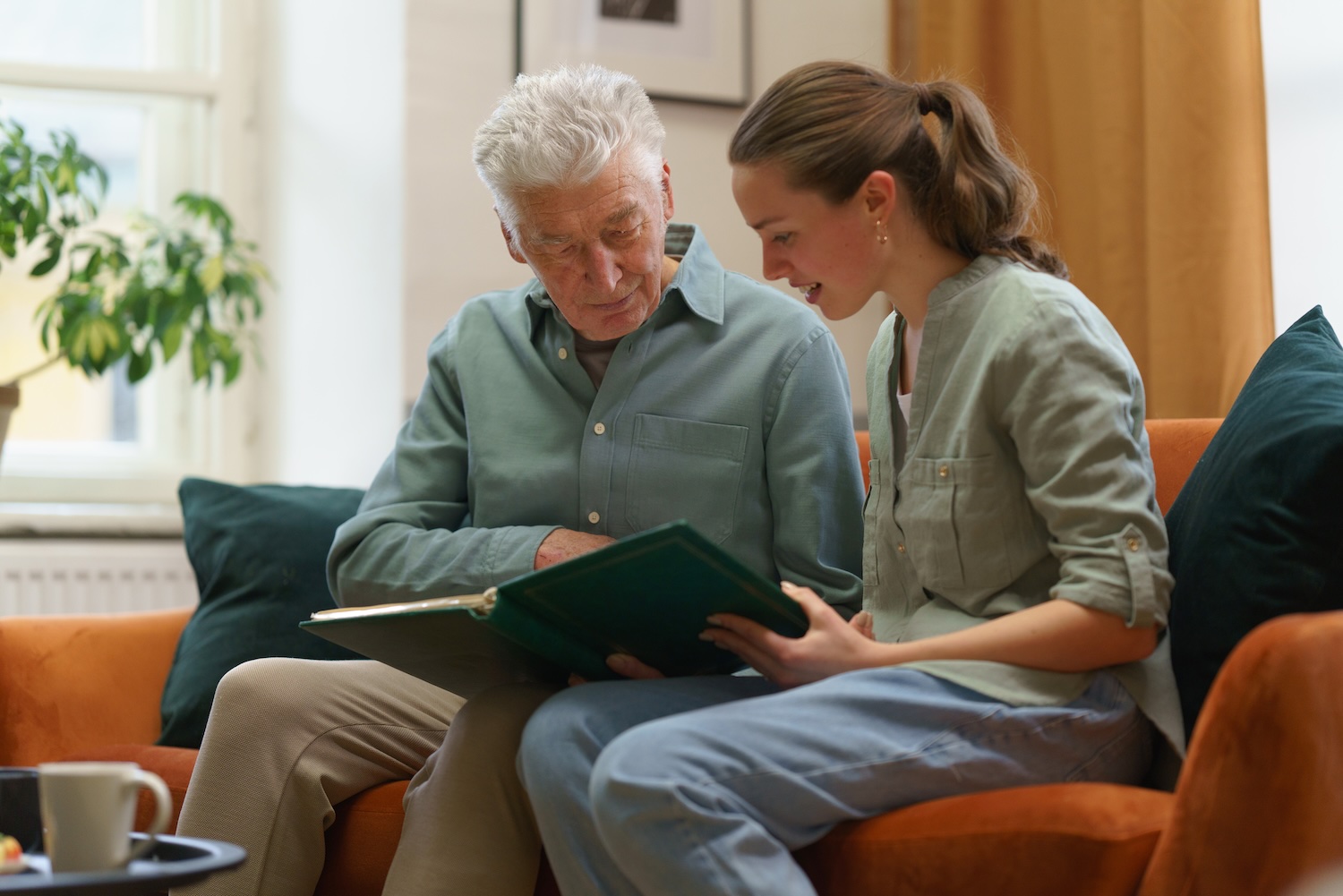 Memory care in Belleville MI with compassionate caregiver helping senior with dementia in a calm home setting