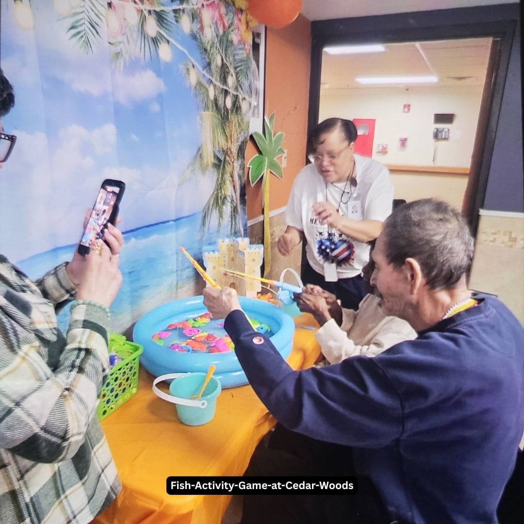 Residents playing a fish activity game at Cedar Woods