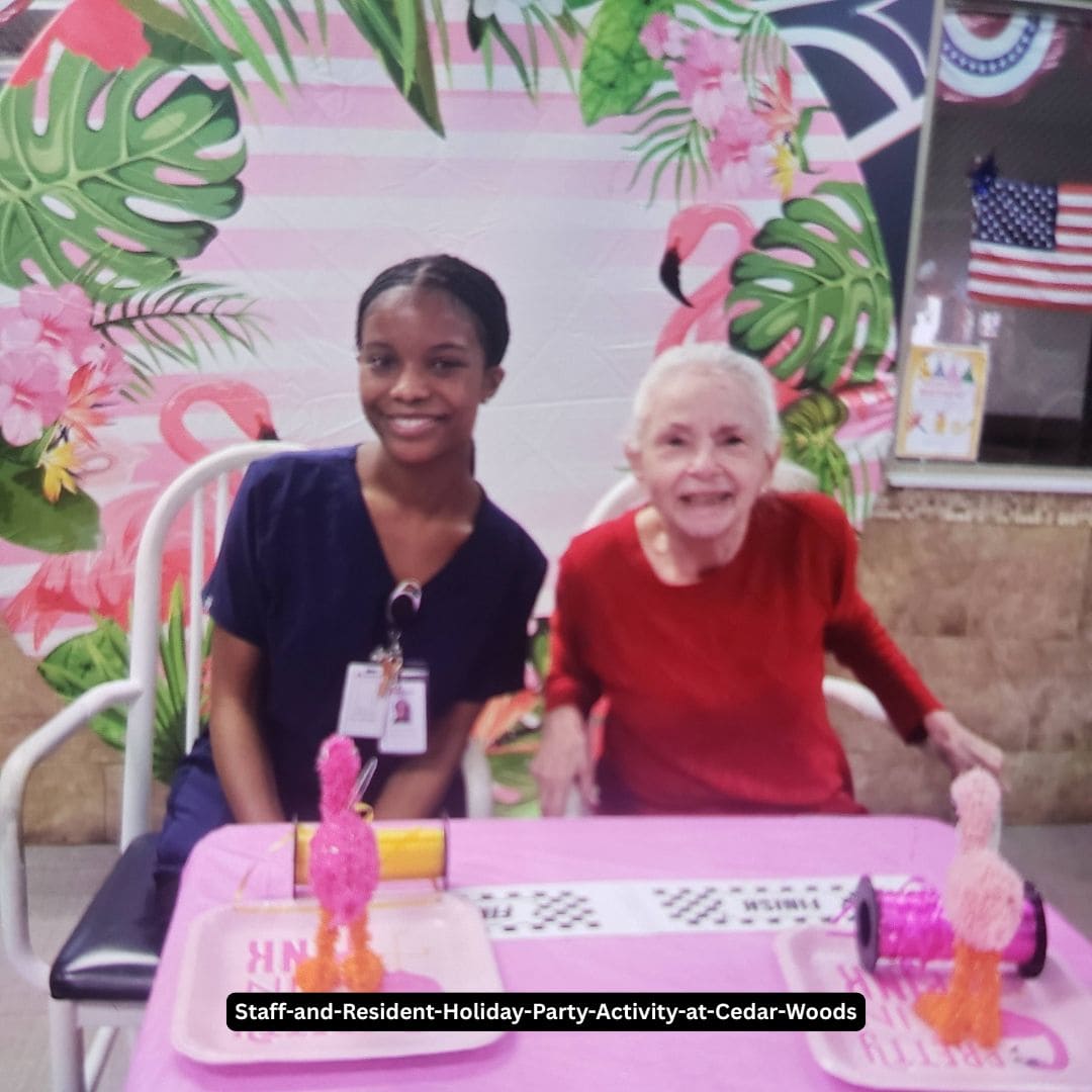 Staff and resident enjoying a holiday party activity at Cedar Woods