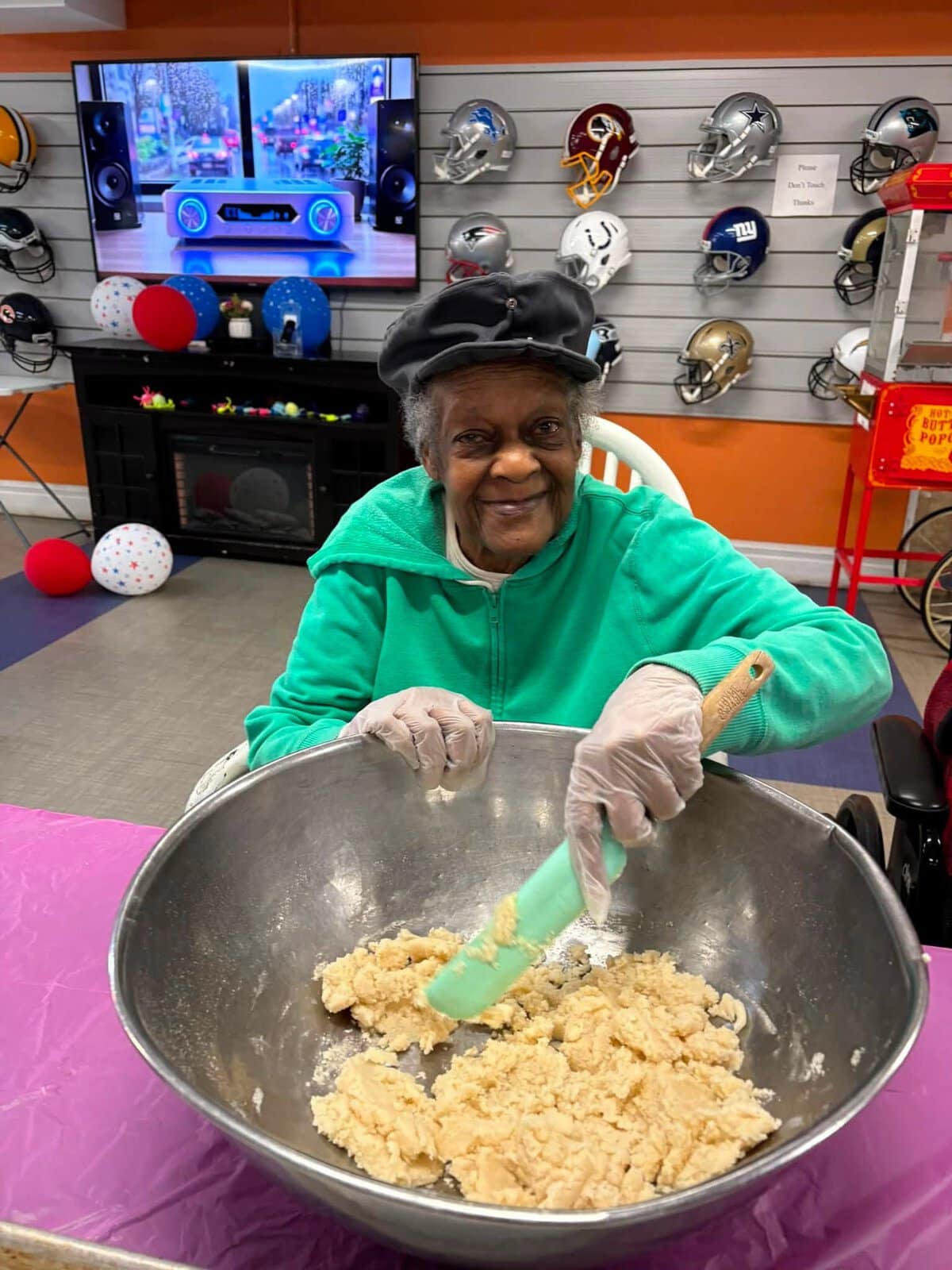 Resident participating in a cookie baking activity at Cedar Woods Assisted Living and Memory Care in Belleville, Michigan