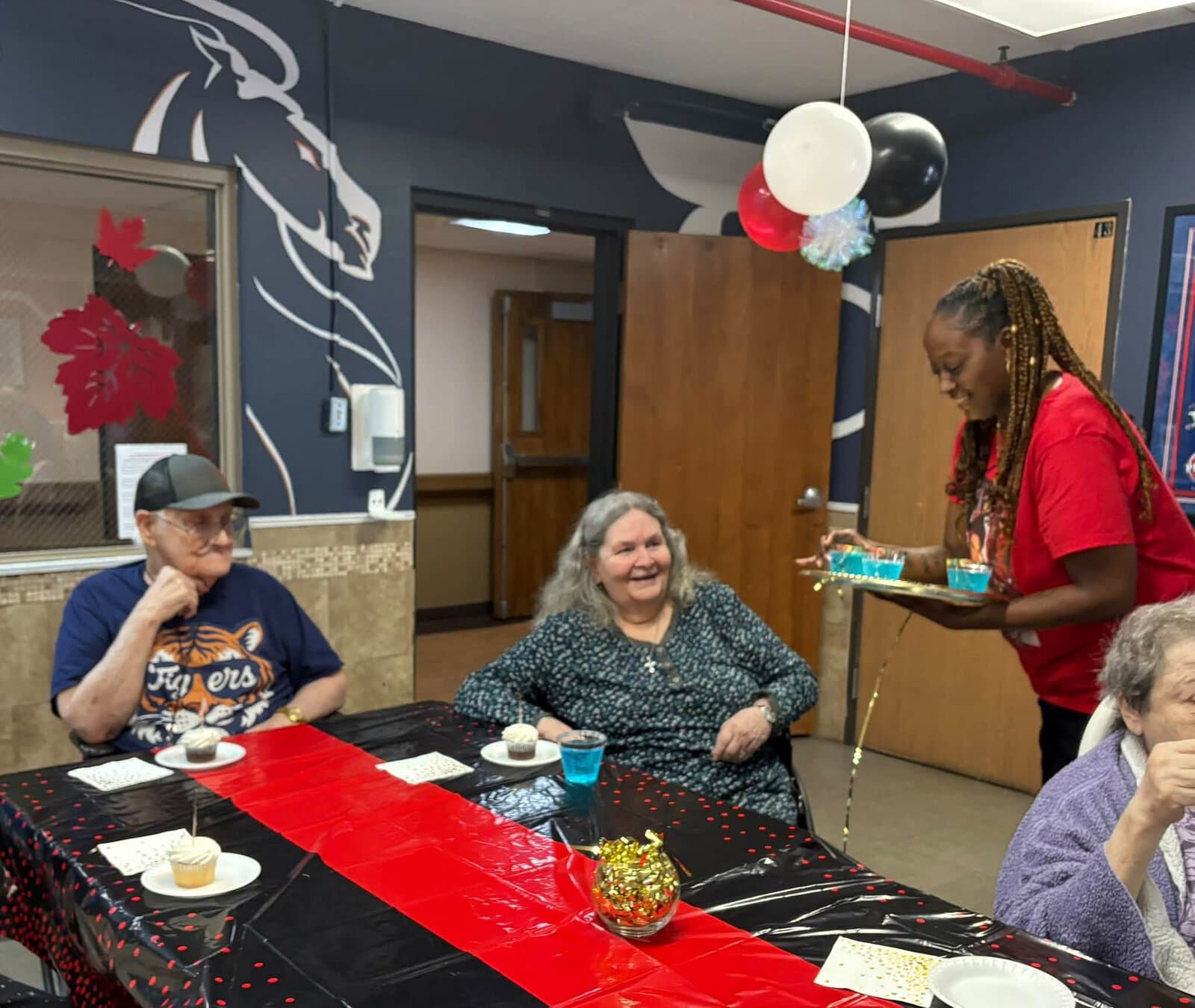 Residents enjoying cupcakes and conversation during a Cedar Woods community celebration