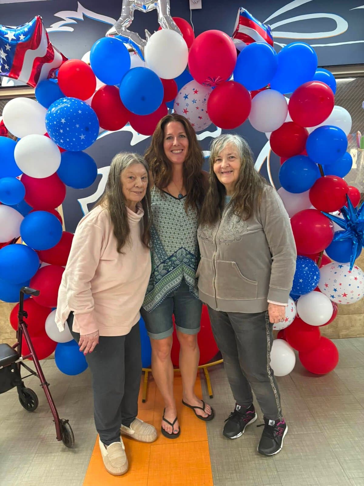 Cedar Woods residents enjoying time together with a visitor during a community celebration