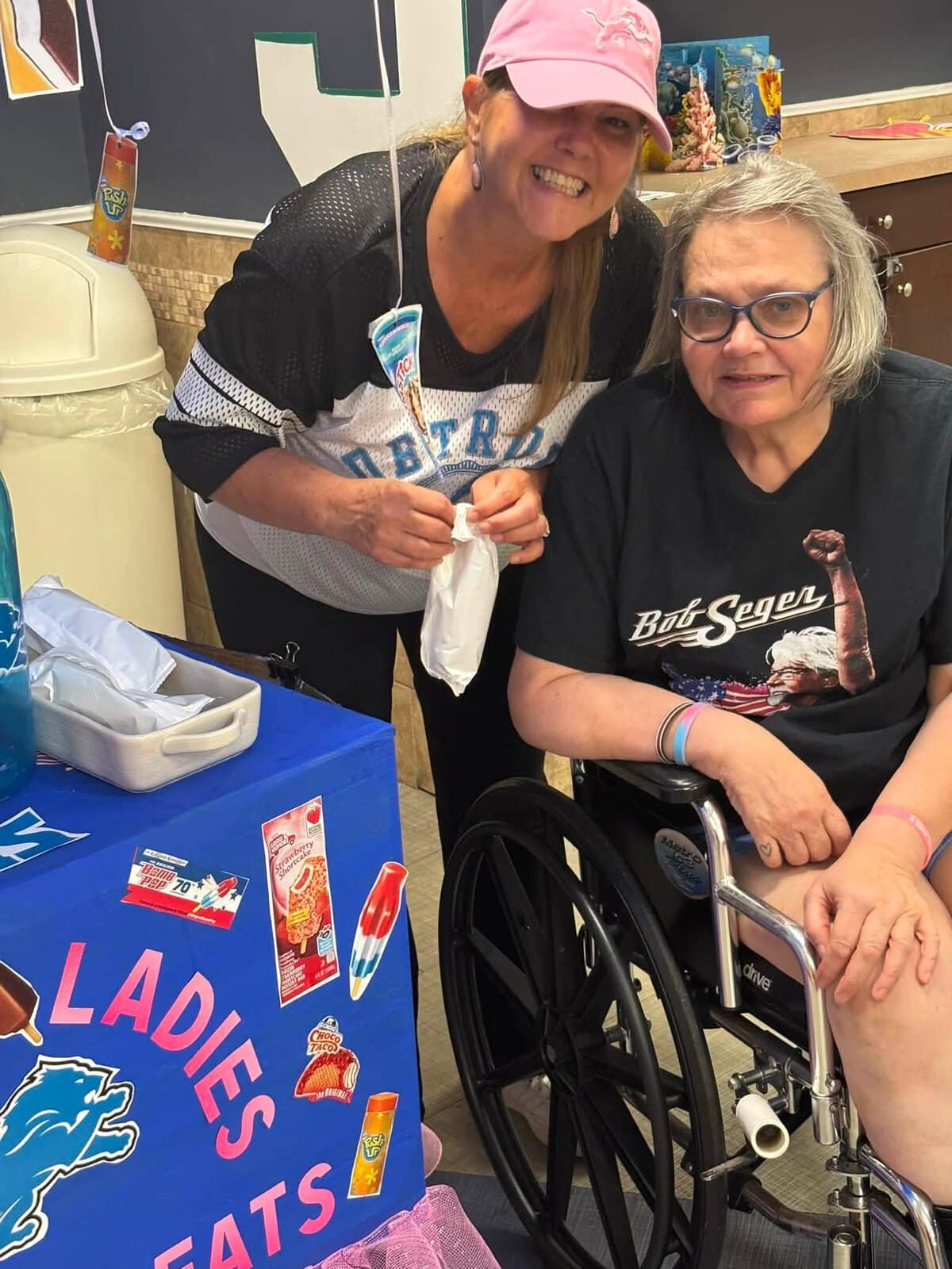 Cedar Woods staff member spending time with a resident